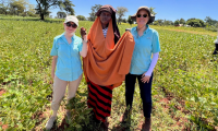 Cottfield outgrower farmer Natise Fatima on her farm in Kachecha District, Butebo accompanied by Annette Donnelly (SIL) and Amy Garren (AOCS)