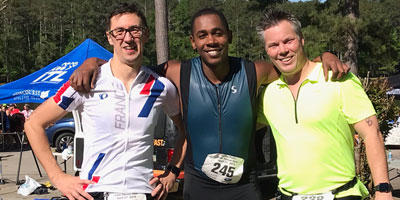 Orayne Mullings and two co-workers photographed after a triathlon