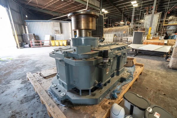 A large industrial machine sitting on top of a pallet.